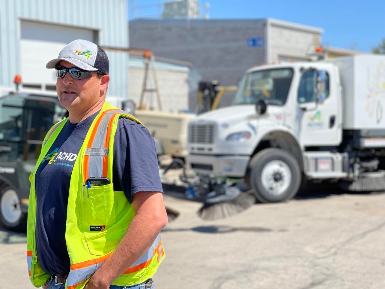 Staff member in front of ACHD truck