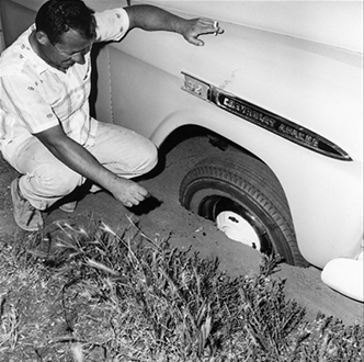 Truck stuck in pothole