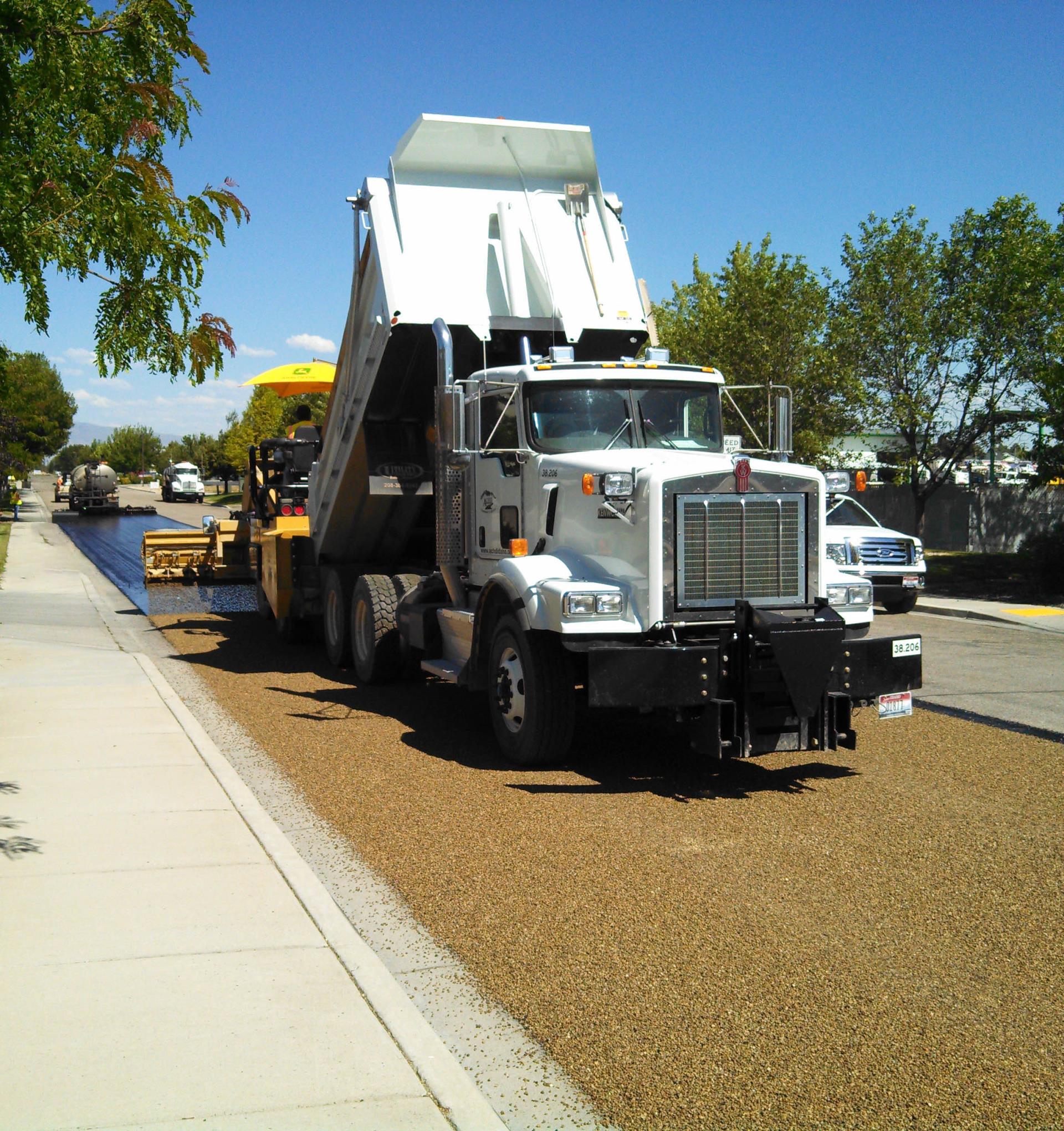 Chip sealing roadway