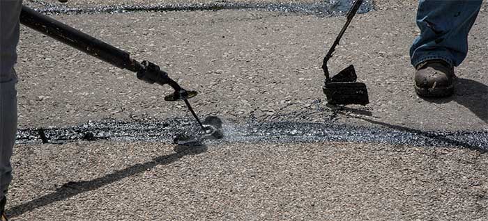 Crack sealing on roadway